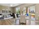 Open-concept living and dining area filled with natural light at 12914 Ironstone Way # 102, Parker, CO 80134
