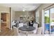 Bright living room with modern decor and dining area at 12914 Ironstone Way # 102, Parker, CO 80134