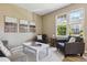 Comfortable living room with neutral tones and stylish decor at 12914 Ironstone Way # 102, Parker, CO 80134