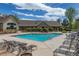 Community pool featuring lounge chairs and well-maintained landscaping at 12914 Ironstone Way # 102, Parker, CO 80134
