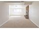 Spacious basement area featuring neutral carpeting and a brick fireplace at 785 Planet Pl, Thornton, CO 80260