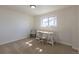 Bright bedroom features neutral walls, carpet, and a window providing natural light at 785 Planet Pl, Thornton, CO 80260