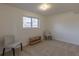 Neutral carpeted room with window offers versatile space for relaxation or entertainment at 785 Planet Pl, Thornton, CO 80260