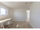 Well-lit room features neutral walls, carpet, and a window providing natural light and pleasant view at 785 Planet Pl, Thornton, CO 80260