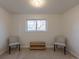 Neutral carpeted room with a window, offering versatile space for relaxation or entertainment at 785 Planet Pl, Thornton, CO 80260