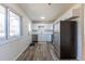 Updated kitchen featuring stainless steel appliances and new flooring at 785 Planet Pl, Thornton, CO 80260