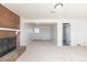 Spacious living room features brick fireplace and ample natural light at 785 Planet Pl, Thornton, CO 80260