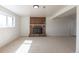 Spacious living room features a brick fireplace and ample natural light at 785 Planet Pl, Thornton, CO 80260