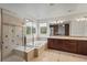 Luxurious bathroom showcasing a separate shower, soaking tub, double vanity, and serene lighting for a spa-like experience at 16823 Weber Way, Mead, CO 80542