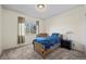Cozy bedroom featuring a twin bed, neutral carpet, a window offering natural light, and simple, comfortable decor at 16823 Weber Way, Mead, CO 80542