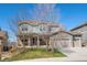 Charming two-story home boasts a two-car garage, well-kept lawn, and inviting curb appeal at 16823 Weber Way, Mead, CO 80542