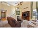 Inviting living room featuring tall ceilings, a fireplace, and large windows at 16823 Weber Way, Mead, CO 80542