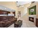 Spacious living room with a fireplace, open floor plan, and access to kitchen and dining area at 16823 Weber Way, Mead, CO 80542