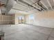 Unfinished basement with sliding glass doors leading to the yard and natural light at 9099 Pitkin St, Commerce City, CO 80022
