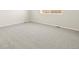 Neutral bedroom with a large window for plenty of natural light and cozy carpet at 9099 Pitkin St, Commerce City, CO 80022