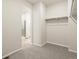 Walk-in closet with carpet and hanging racks, offering ample storage space at 9099 Pitkin St, Commerce City, CO 80022