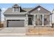 Charming single-Gathering home with a two-car garage and landscaped front yard at 9099 Pitkin St, Commerce City, CO 80022