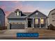 Charming single-Gathering home featuring a two-car garage and stylish architectural details at 9099 Pitkin St, Commerce City, CO 80022