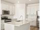 Bright kitchen featuring stainless steel appliances, granite countertops, and ample cabinet space at 9099 Pitkin St, Commerce City, CO 80022