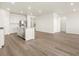 Open-concept living area featuring a modern kitchen with stainless steel appliances and a large island at 9099 Pitkin St, Commerce City, CO 80022