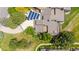 Drone shot of the residence showing lush greenery, well-manicured lawns, solar panels, and private patio areas at 7300 W Stetson Pl # 46, Littleton, CO 80123