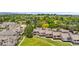 Aerial view capturing a residential neighborhood with green spaces, landscaping, and private outdoor living areas at 7300 W Stetson Pl # 46, Littleton, CO 80123