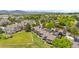Townhomes with patios overlooking large green lawns and solar panels on the roofs, showcasing an eco-friendly community at 7300 W Stetson Pl # 46, Littleton, CO 80123