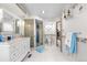 Bright bathroom features a glass block shower, marble counters, and modern fixtures at 7300 W Stetson Pl # 46, Littleton, CO 80123