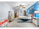 Stylish bedroom featuring a cozy quilt and bright blue accent wall at 7300 W Stetson Pl # 46, Littleton, CO 80123