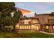Charming condo with a spacious deck overlooking a well-manicured lawn at sunset at 7300 W Stetson Pl # 46, Littleton, CO 80123