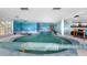 Expansive indoor pool area with underwater murals and unique design, combining recreation and art in one space at 7300 W Stetson Pl # 46, Littleton, CO 80123