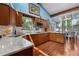 Stylish kitchen with wood cabinets, granite countertops, and stainless steel appliances at 7300 W Stetson Pl # 46, Littleton, CO 80123