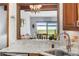Kitchen sink with granite counters, and an open view of the dining area at 7300 W Stetson Pl # 46, Littleton, CO 80123
