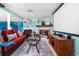 Cozy living room features a fireplace, comfortable seating, and large screen, ideal for entertaining and relaxation at 7300 W Stetson Pl # 46, Littleton, CO 80123