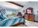 Bright and open main bedroom offering sliding glass door access to the outdoor space at 7300 W Stetson Pl # 46, Littleton, CO 80123