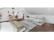 Bright bedroom featuring hardwood floors, vaulted ceiling, desk, and neutral-toned sofa and rug at 328 S Lincoln St, Denver, CO 80209