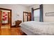 Comfortable bedroom with hardwood floors, white walls, and a window with curtains at 328 S Lincoln St, Denver, CO 80209