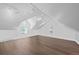Bright bedroom featuring hardwood floors, angled ceilings, recessed lights, and two windows at 328 S Lincoln St, Denver, CO 80209
