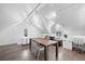 Bonus room featuring wooden floors, sloped ceiling, and lots of light at 328 S Lincoln St, Denver, CO 80209
