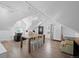 Brightly lit bonus room with light wooden floors, white walls, and a table with chairs at 328 S Lincoln St, Denver, CO 80209
