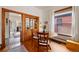 Charming dining area featuring a built-in cabinet, hardwood floors, and a bright window at 328 S Lincoln St, Denver, CO 80209