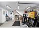 Converted garage with stairs, printing equipment, storage, and lots of light at 328 S Lincoln St, Denver, CO 80209