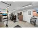 A converted garage space featuring multiple printing equipment, high ceilings and bright lighting at 328 S Lincoln St, Denver, CO 80209