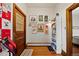 Entryway with hardwood floors, decorative wall art, and a charming wooden door at 328 S Lincoln St, Denver, CO 80209