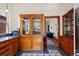 Classic kitchen featuring beautiful cabinetry, tile flooring, and a view into the living room at 328 S Lincoln St, Denver, CO 80209
