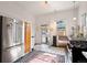Bright kitchen featuring stainless steel appliances, tiled floors, and ample natural light at 328 S Lincoln St, Denver, CO 80209