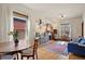 Open-concept living and dining area with hardwood floors and ample natural light at 328 S Lincoln St, Denver, CO 80209