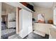 Mudroom with storage cabinet, slate flooring, and access to the backyard at 328 S Lincoln St, Denver, CO 80209
