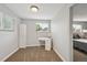 Bright bedroom with a white desk setup and a large window for natural light at 3930 S Hazel Ct, Englewood, CO 80110