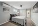 Cozy bedroom with neutral tones, mini-split air conditioning, carpet floors, and lots of natural light at 3930 S Hazel Ct, Englewood, CO 80110
